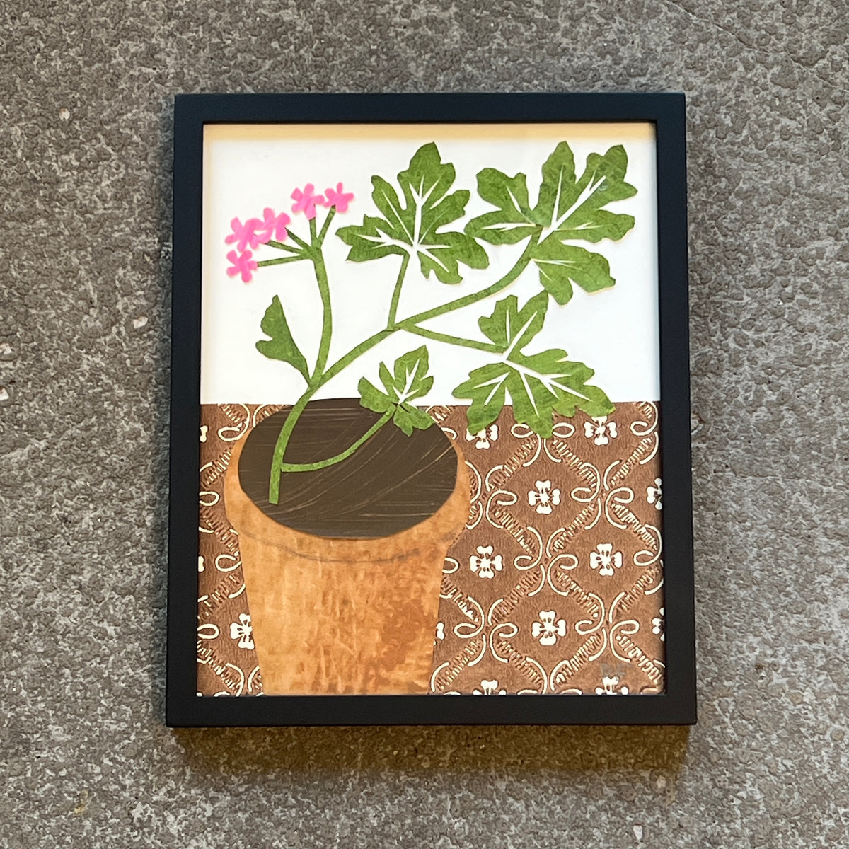 Scented Geranium on Brown Patterned Tablecloth by Denise Fiedler