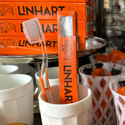 Orange Toothbrush with White Bristles